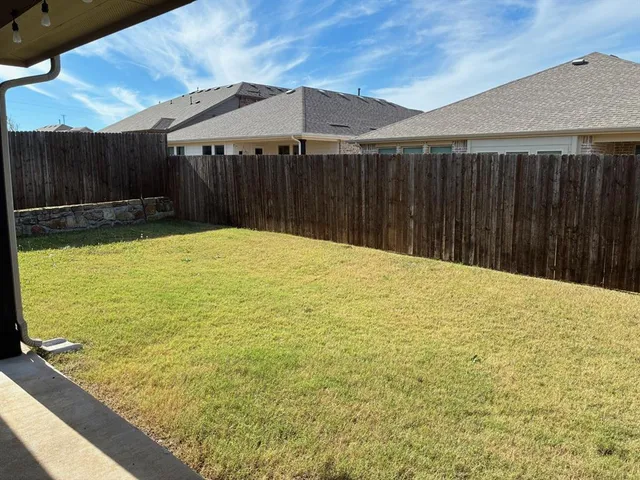 a swimming pool with wooden fence