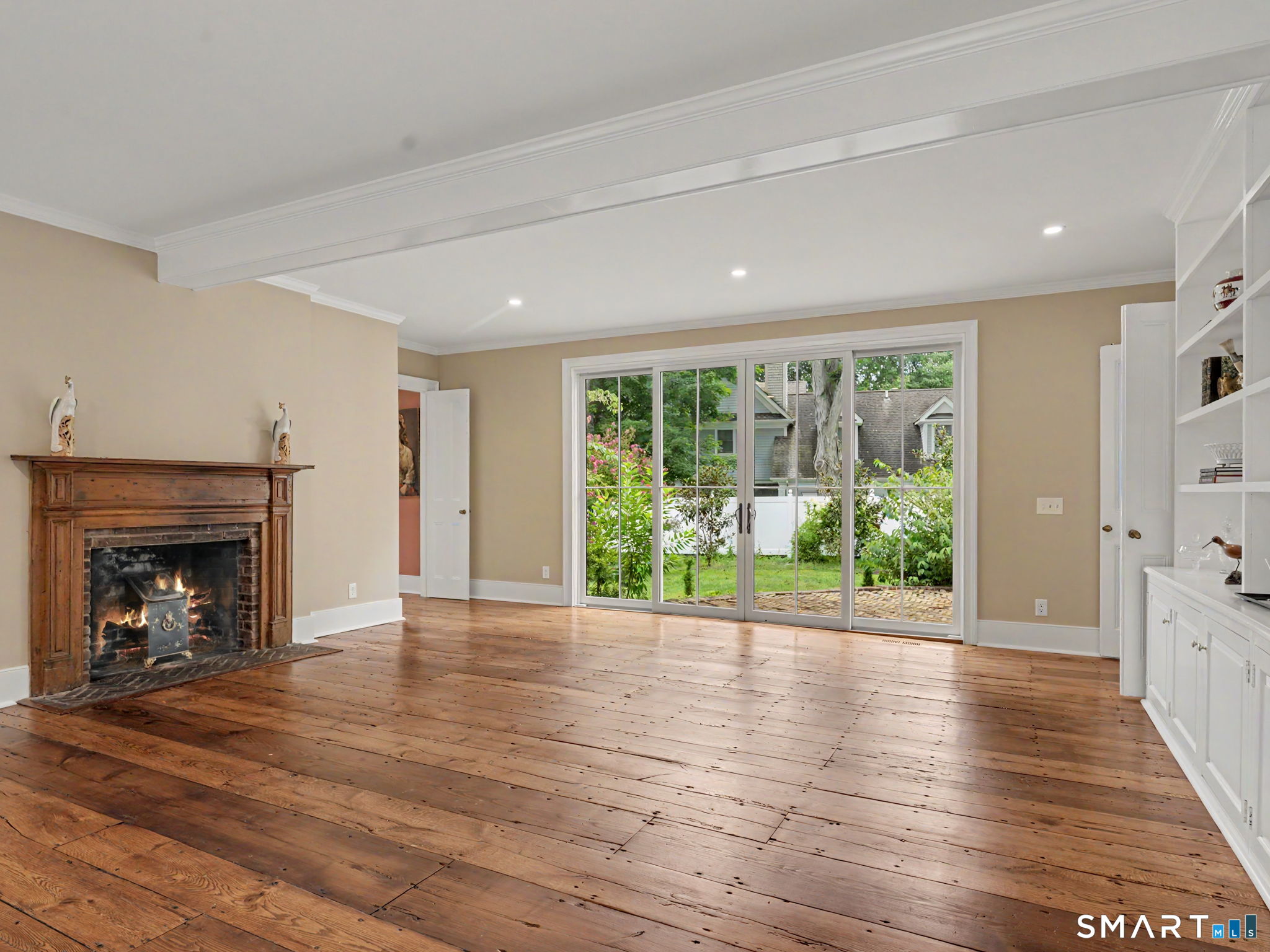530 Roxbury Road Stamford, CT 06902 - Photo 11 of 40 Oversized family room with fireplace and built-in shelving