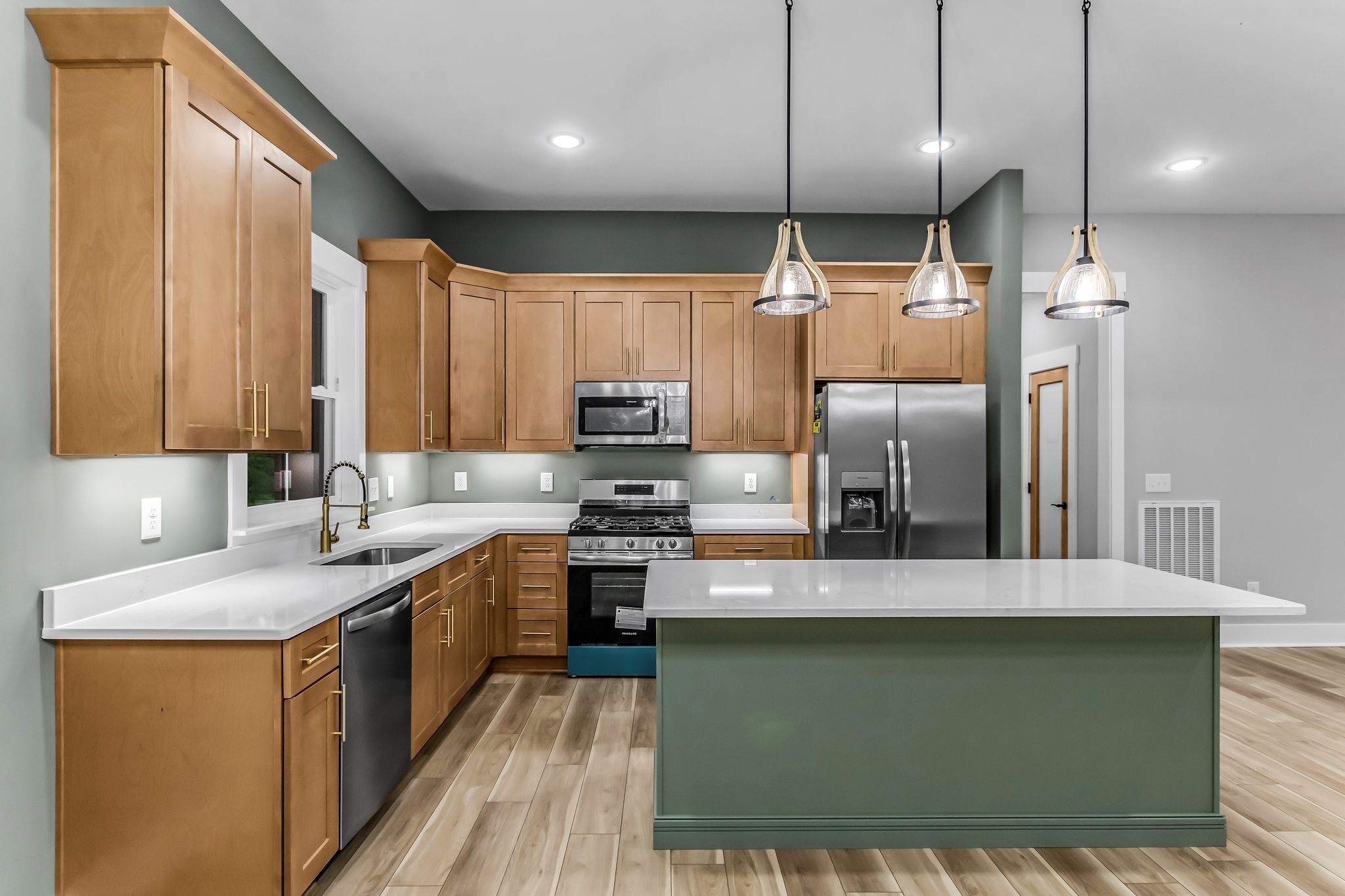 4106 Asbury Road Manchester, TN 37355 - Photo 11 of 58 a kitchen with a sink a counter top space stainless steel appliances and cabinets