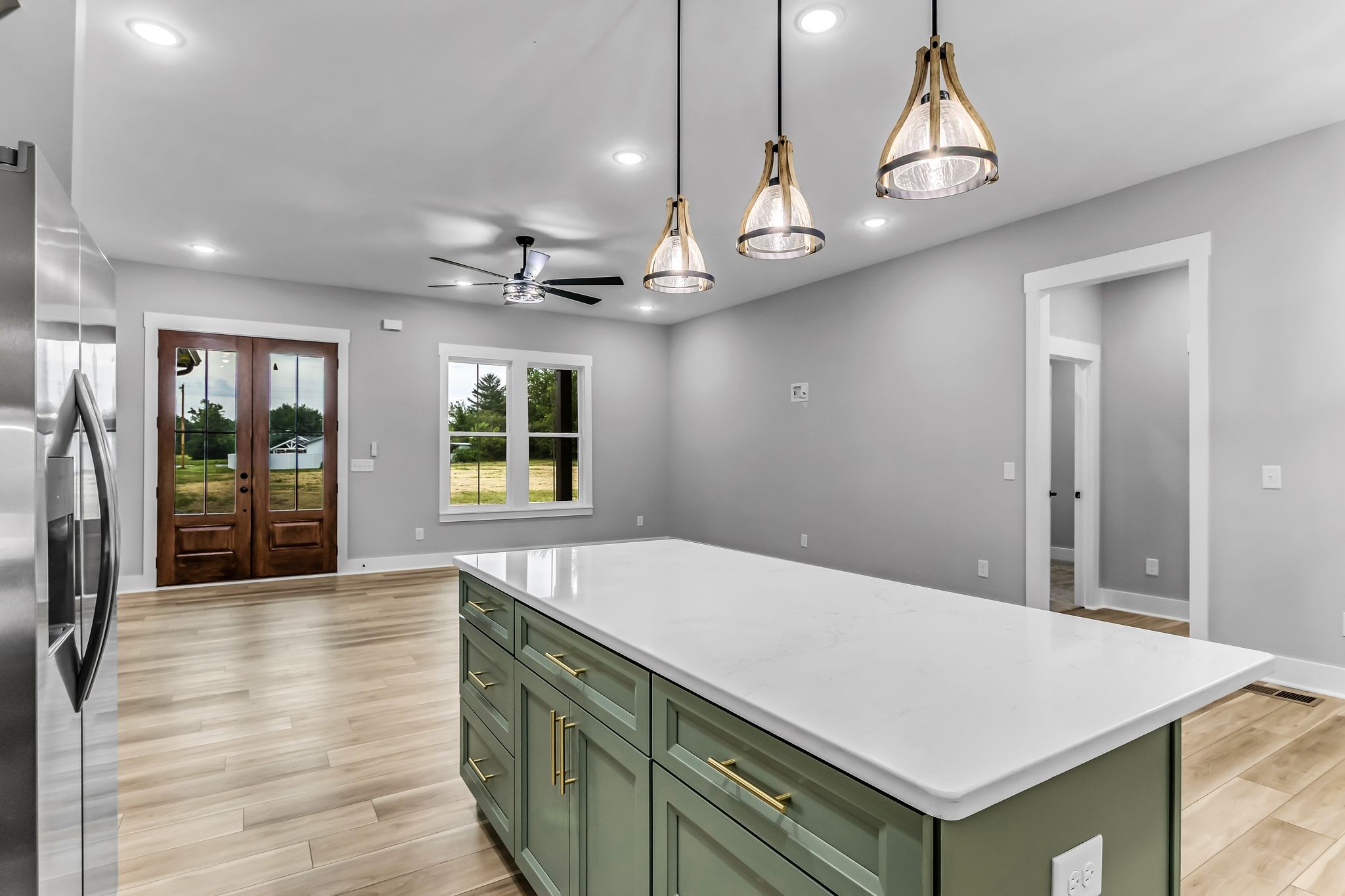 4106 Asbury Road Manchester, TN 37355 - Photo 12 of 58 a view of a hallway with wooden floor and chandelier