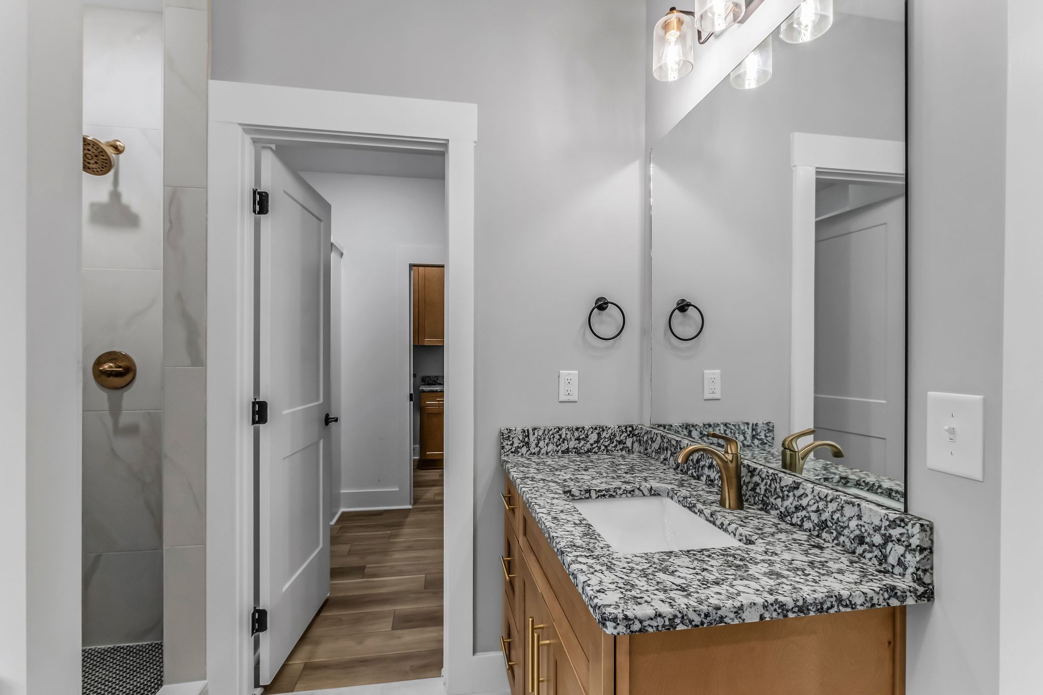 4106 Asbury Road Manchester, TN 37355 - Photo 25 of 58 a bathroom with a granite countertop sink and a mirror