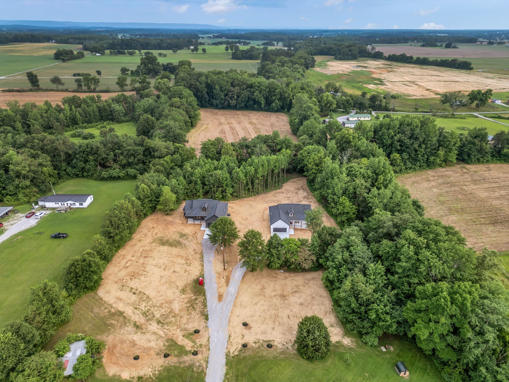 4106 Asbury Road Manchester, TN 37355 - Photo 52 of 58 an aerial view of a house with a yard and lake view