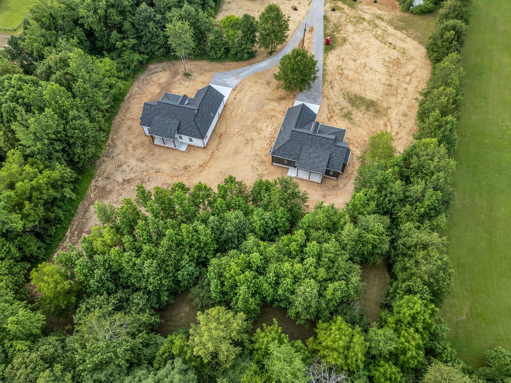 4106 Asbury Road Manchester, TN 37355 - Photo 53 of 58 an aerial view of a house with outdoor space and trees all around