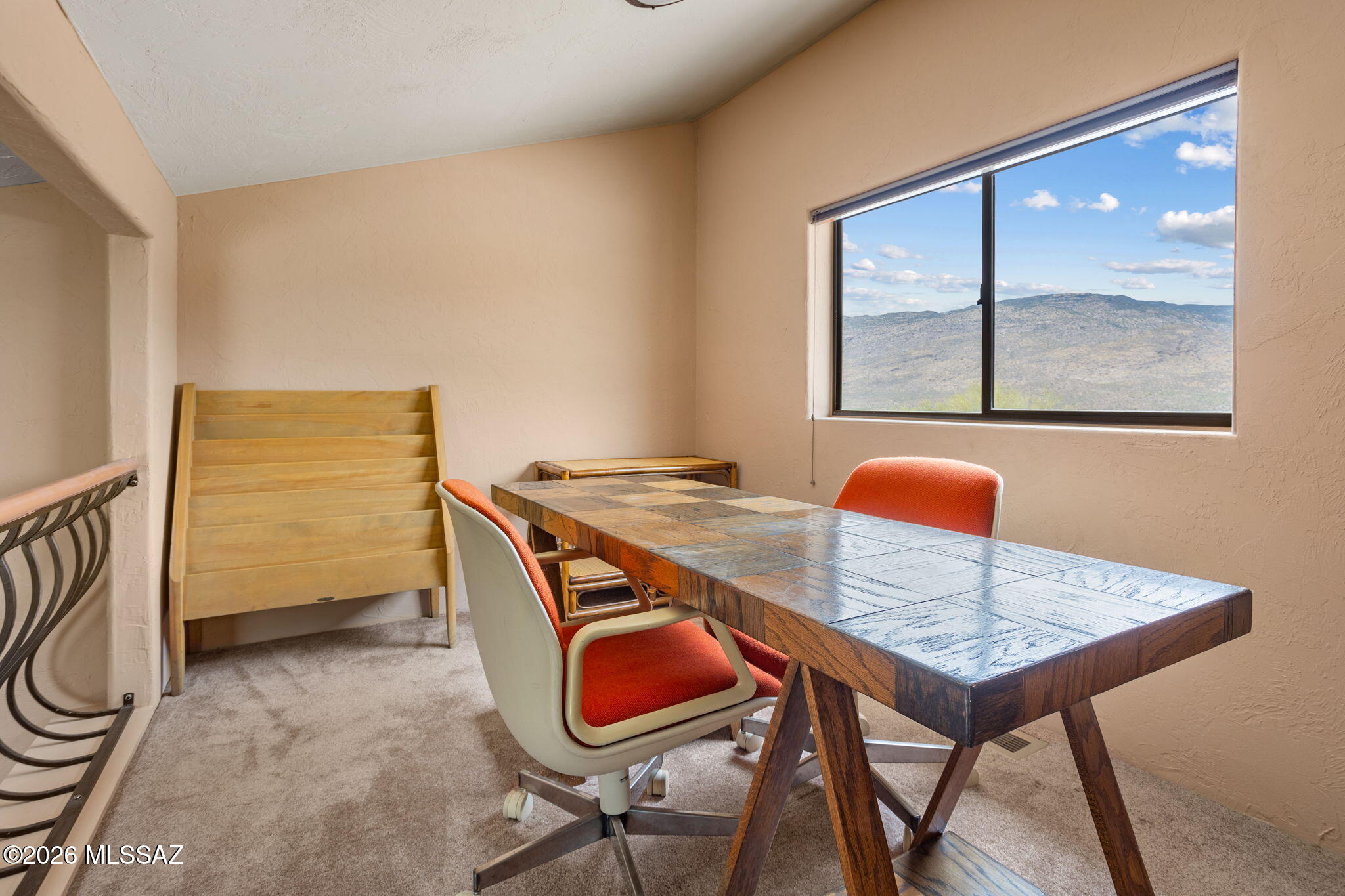 7171 South X9 Ranch Road Vail, AZ 85641 - Photo 29 of 50 Bedroom 3 has a furnished loft! 3 pc rattan shelving, checkerboard-pattern wood desk, & Magazine holder.