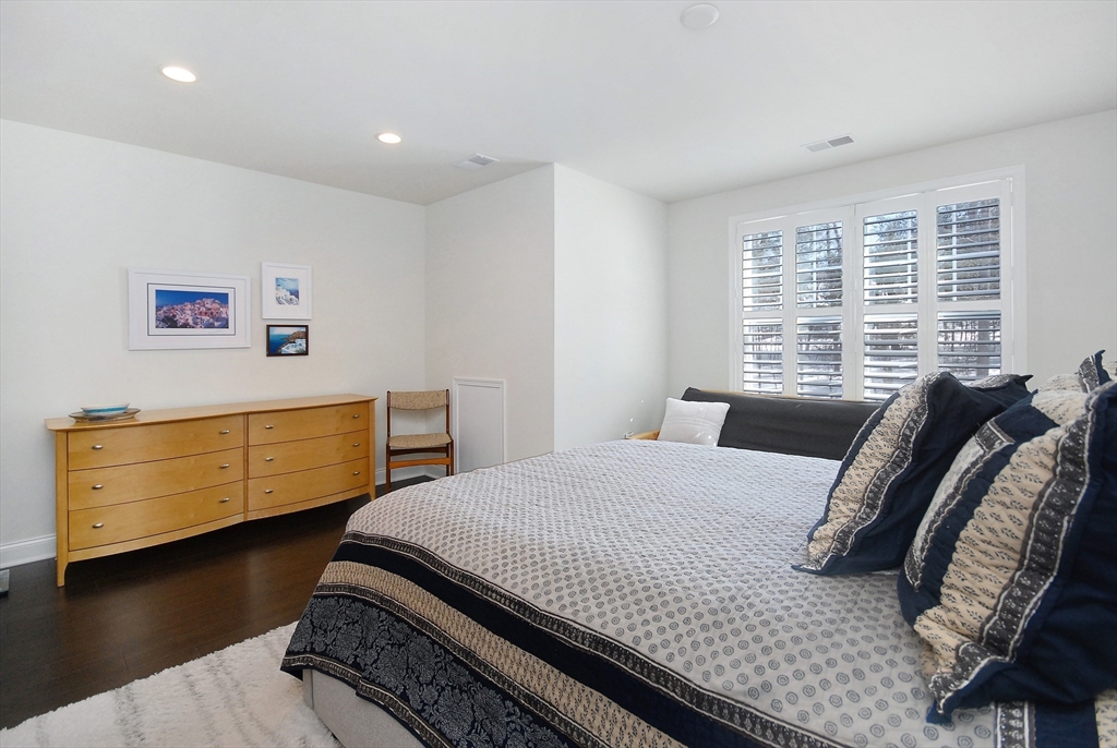 39 Ridgewood Drive, Unit 39 Stow, MA 01775 - Photo 16 of 26 a bedroom with a bed and a window