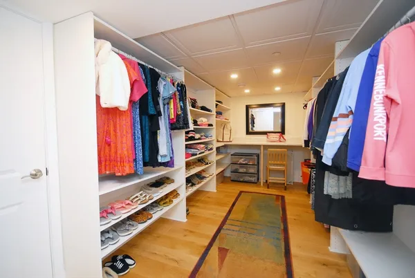a view of a living room with furniture and a fireplace