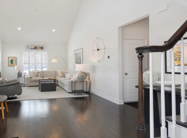 a living room with furniture window and wooden floor
