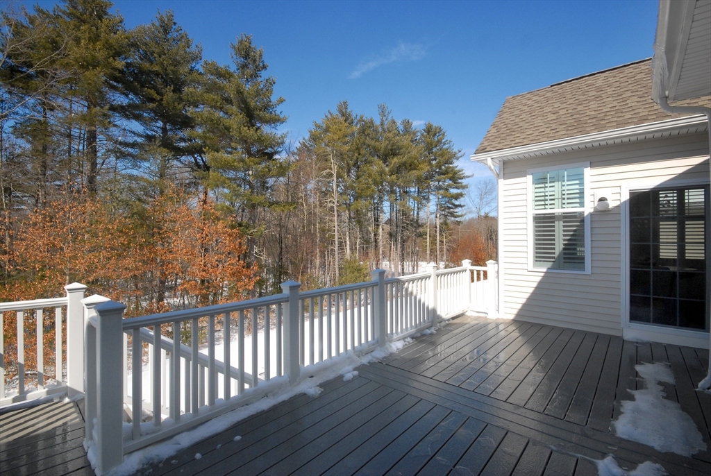 39 Ridgewood Drive, Unit 39 Stow, MA 01775 - Photo 23 of 26 a view of a house with wooden deck