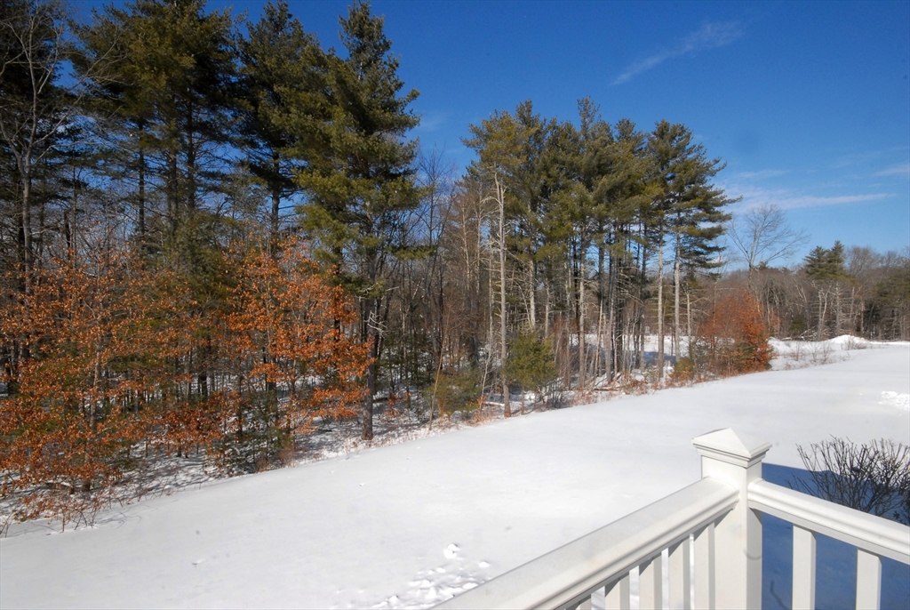 39 Ridgewood Drive, Unit 39 Stow, MA 01775 - Photo 24 of 26 a view of wooden fence and a yard