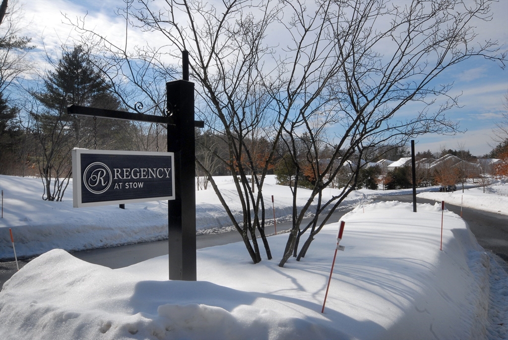 39 Ridgewood Drive, Unit 39 Stow, MA 01775 - Photo 26 of 26 a view of a street with trees on the side of the road