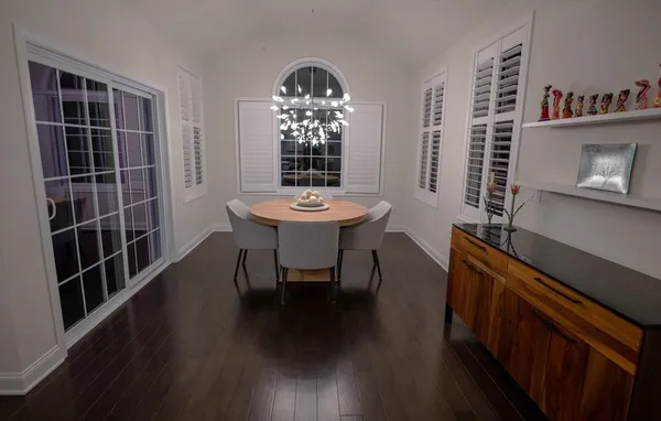 a view of a room with furniture and window