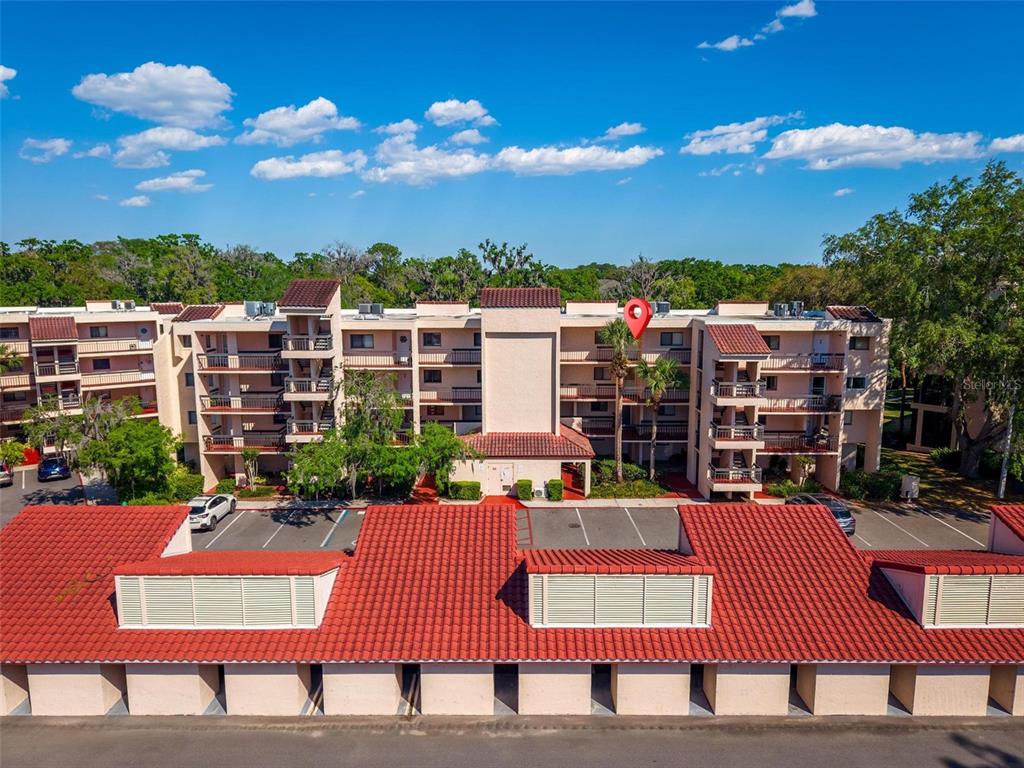 a wooden bench sitting in front of a building