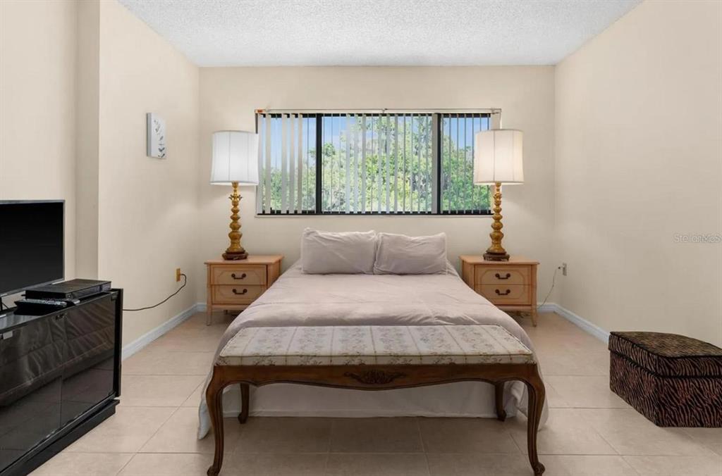 1162 Carmel Circle, Unit 440 Casselberry, FL 32707 - Photo 11 of 30 a bedroom with a bed and a couch