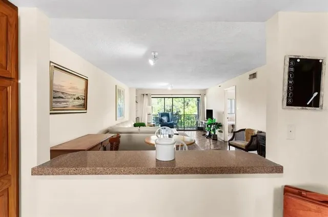 a view of living room with furniture and flat screen tv