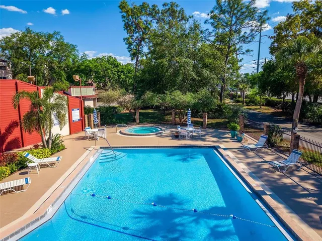 a swimming pool with chairs