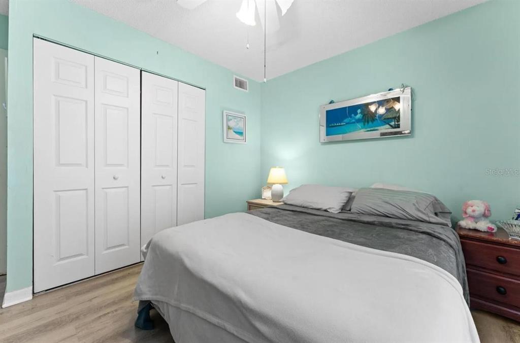 1162 Carmel Circle, Unit 440 Casselberry, FL 32707 - Photo 3 of 30 a bedroom with a bed and a chandelier