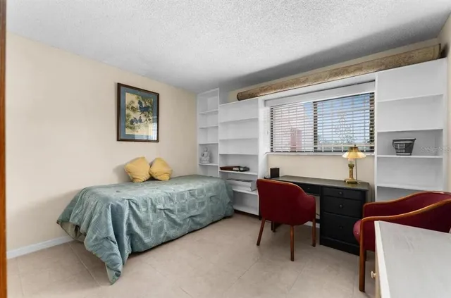 a bedroom with furniture and a bed