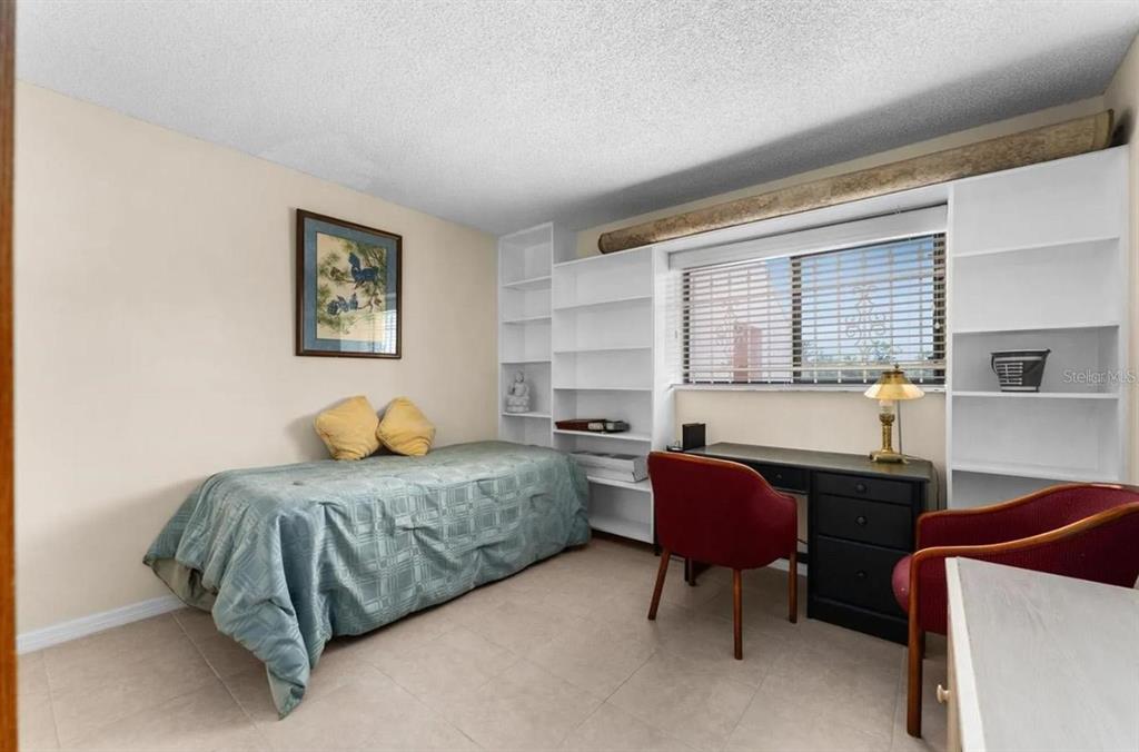 1162 Carmel Circle, Unit 440 Casselberry, FL 32707 - Photo 9 of 30 a bedroom with furniture and a bed