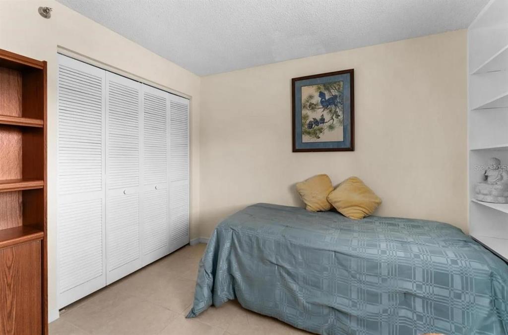 1162 Carmel Circle, Unit 440 Casselberry, FL 32707 - Photo 10 of 30 a bedroom with a bed and a cabinets