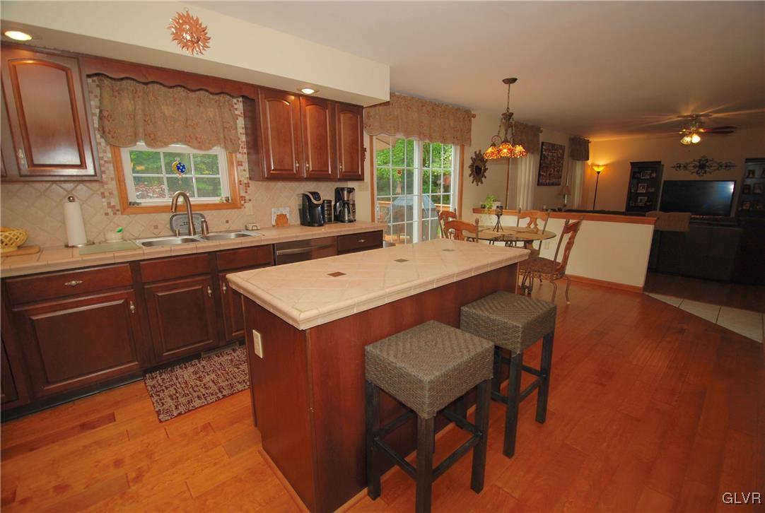 625 Turkey Ridge Road Mount Bethel, PA 18343 - Photo 13 of 43 a kitchen with a sink a stove a table and chairs