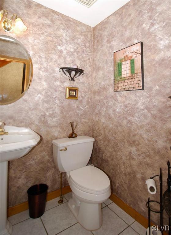 625 Turkey Ridge Road Mount Bethel, PA 18343 - Photo 17 of 43 a bathroom with a toilet a sink and mirror