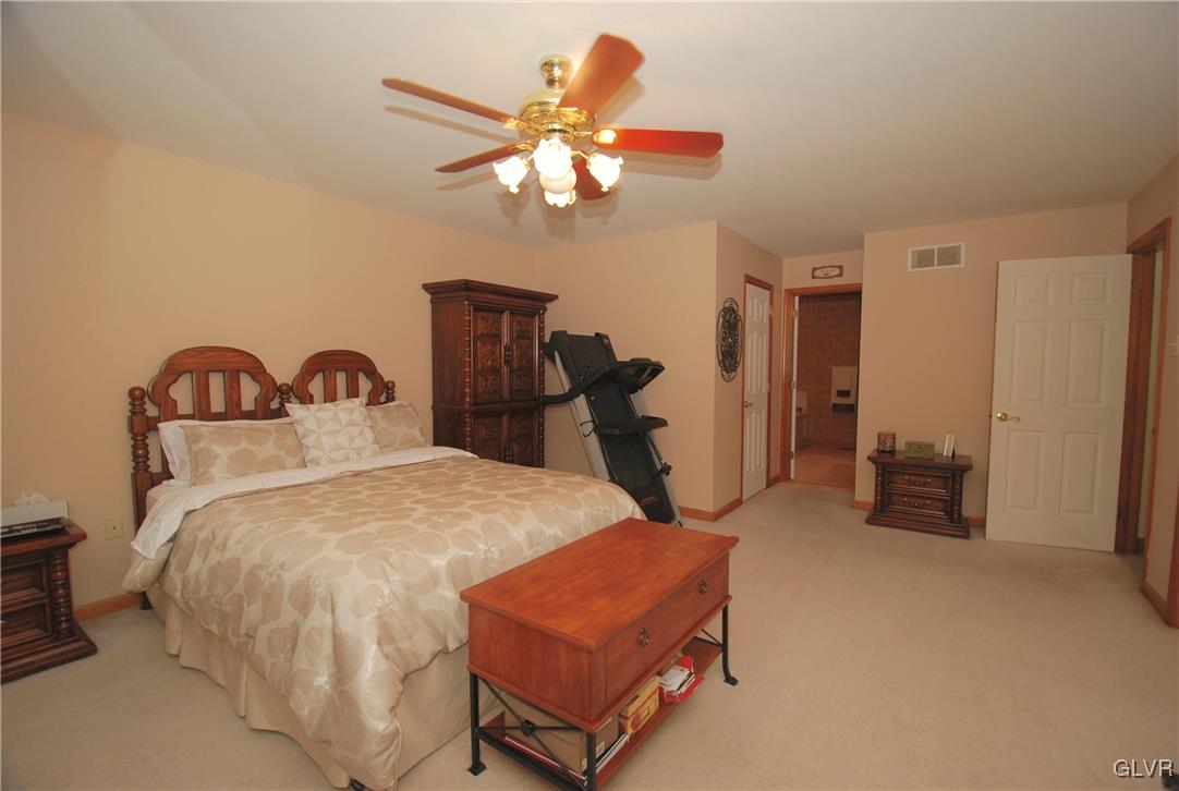 625 Turkey Ridge Road Mount Bethel, PA 18343 - Photo 20 of 43 a bedroom with bed and wooden floor