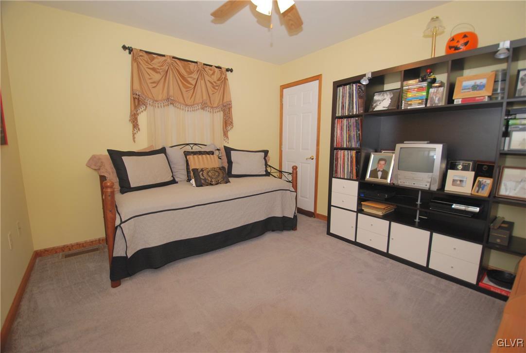625 Turkey Ridge Road Mount Bethel, PA 18343 - Photo 26 of 43 a bedroom with furniture and a book shelf