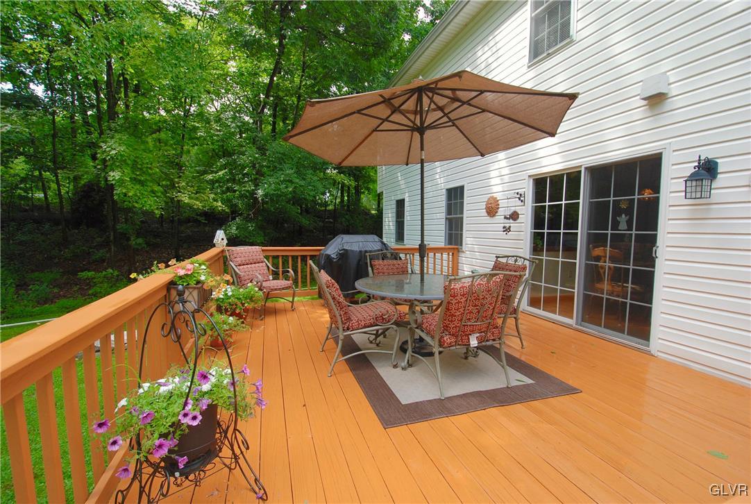 625 Turkey Ridge Road Mount Bethel, PA 18343 - Photo 32 of 43 a view of a patio with chairs under an umbrella