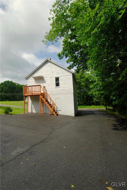 625 Turkey Ridge Road Mount Bethel, PA 18343 - Photo 40 of 43 a view of a house with a yard and garage