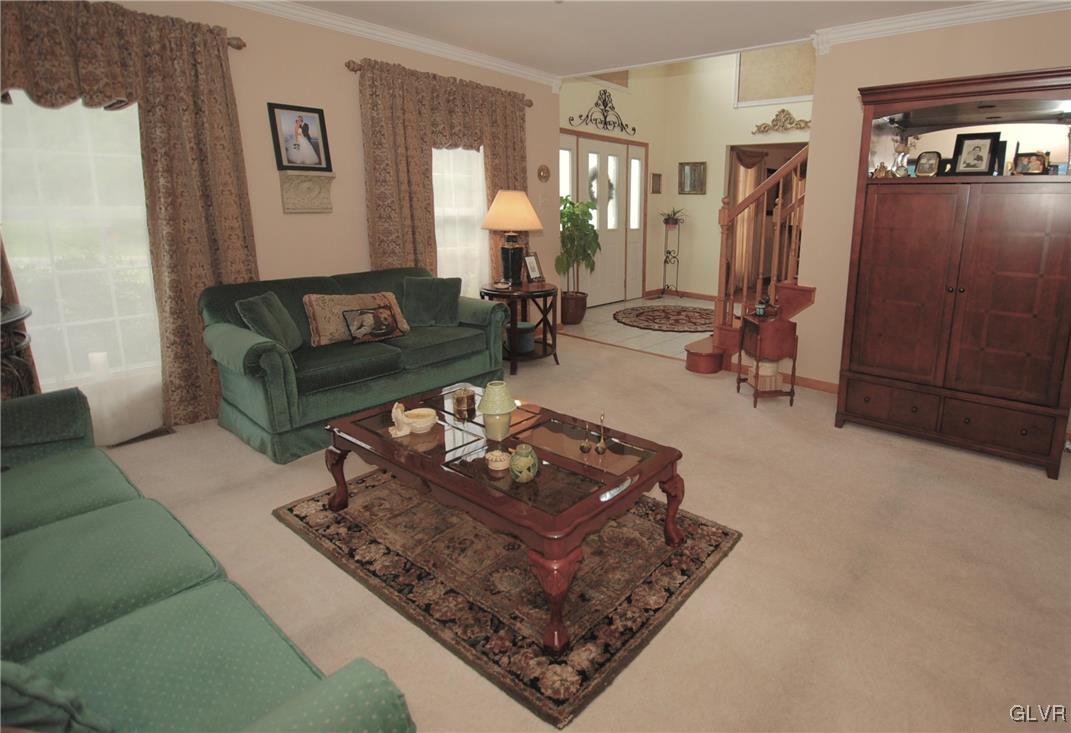 625 Turkey Ridge Road Mount Bethel, PA 18343 - Photo 7 of 43 a living room with furniture and a rug