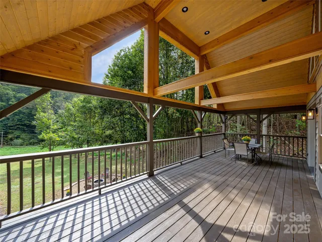 a view of a balcony with wooden floor