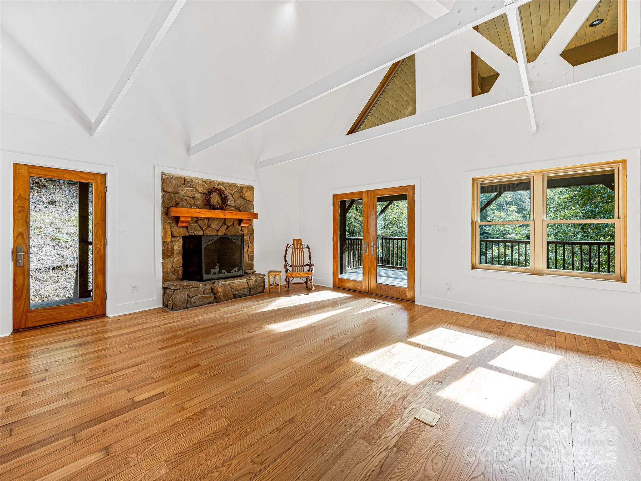 2725 Upper Brush Creek Road Marshall, NC 28753 - Photo 17 of 48 a view of an empty room with wooden floor and a window