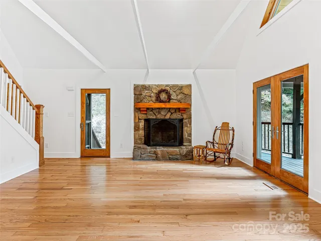 a view of a livingroom with furniture and a fireplace