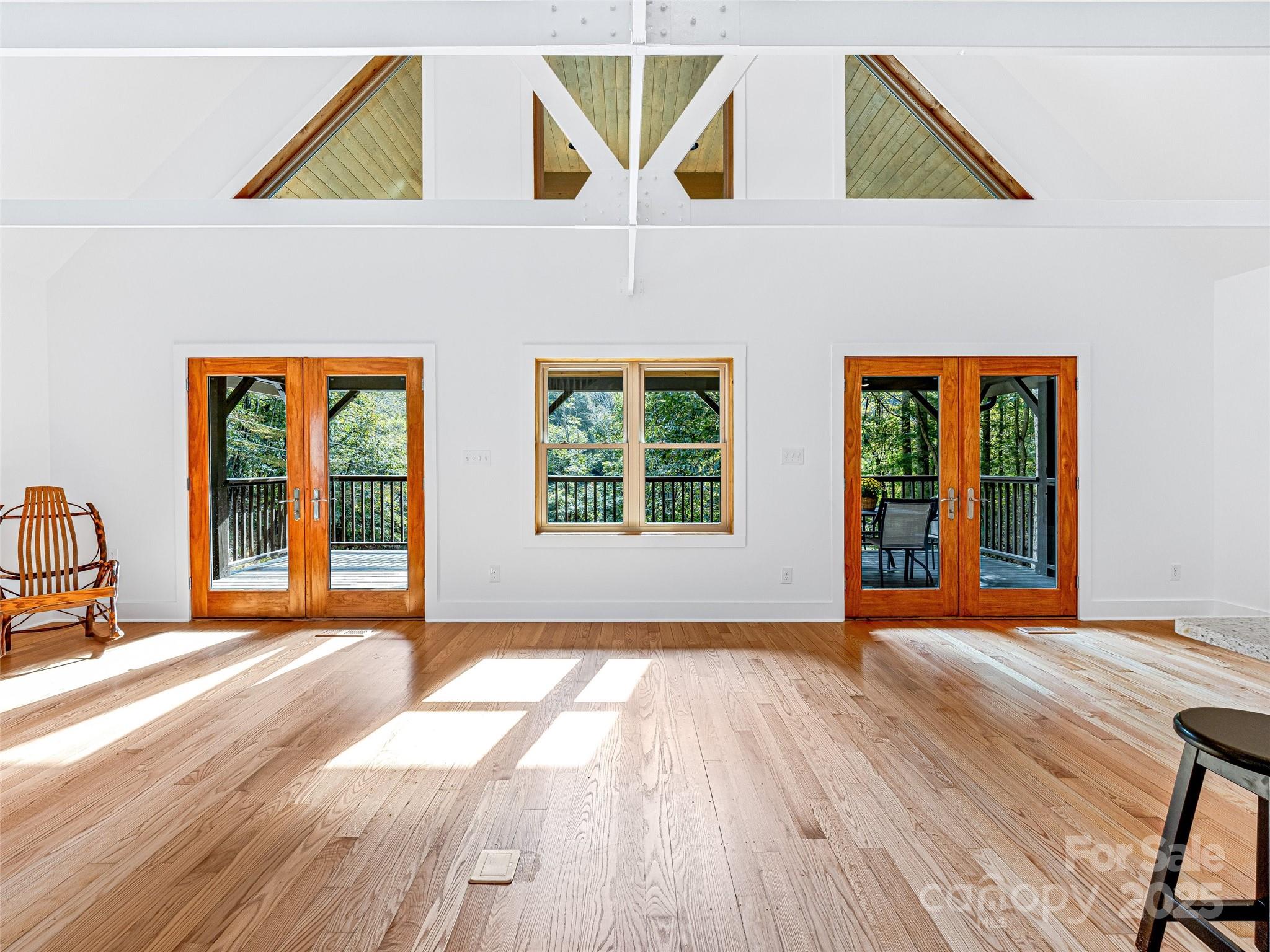 2725 Upper Brush Creek Road Marshall, NC 28753 - Photo 19 of 48 a view of a house with wooden floor and windows