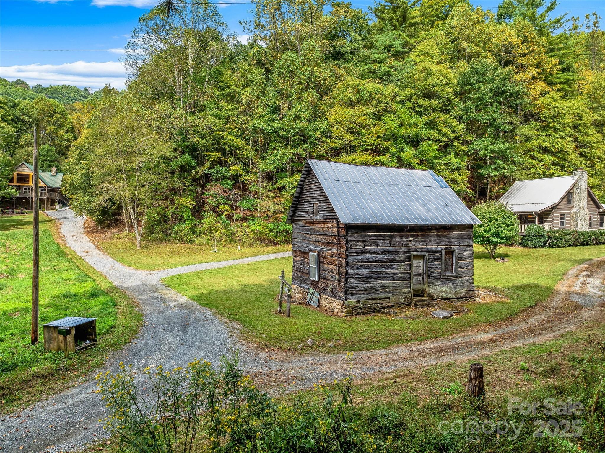 2725 Upper Brush Creek Road Marshall, NC 28753 - Photo 33 of 48 a view of a house with a yard