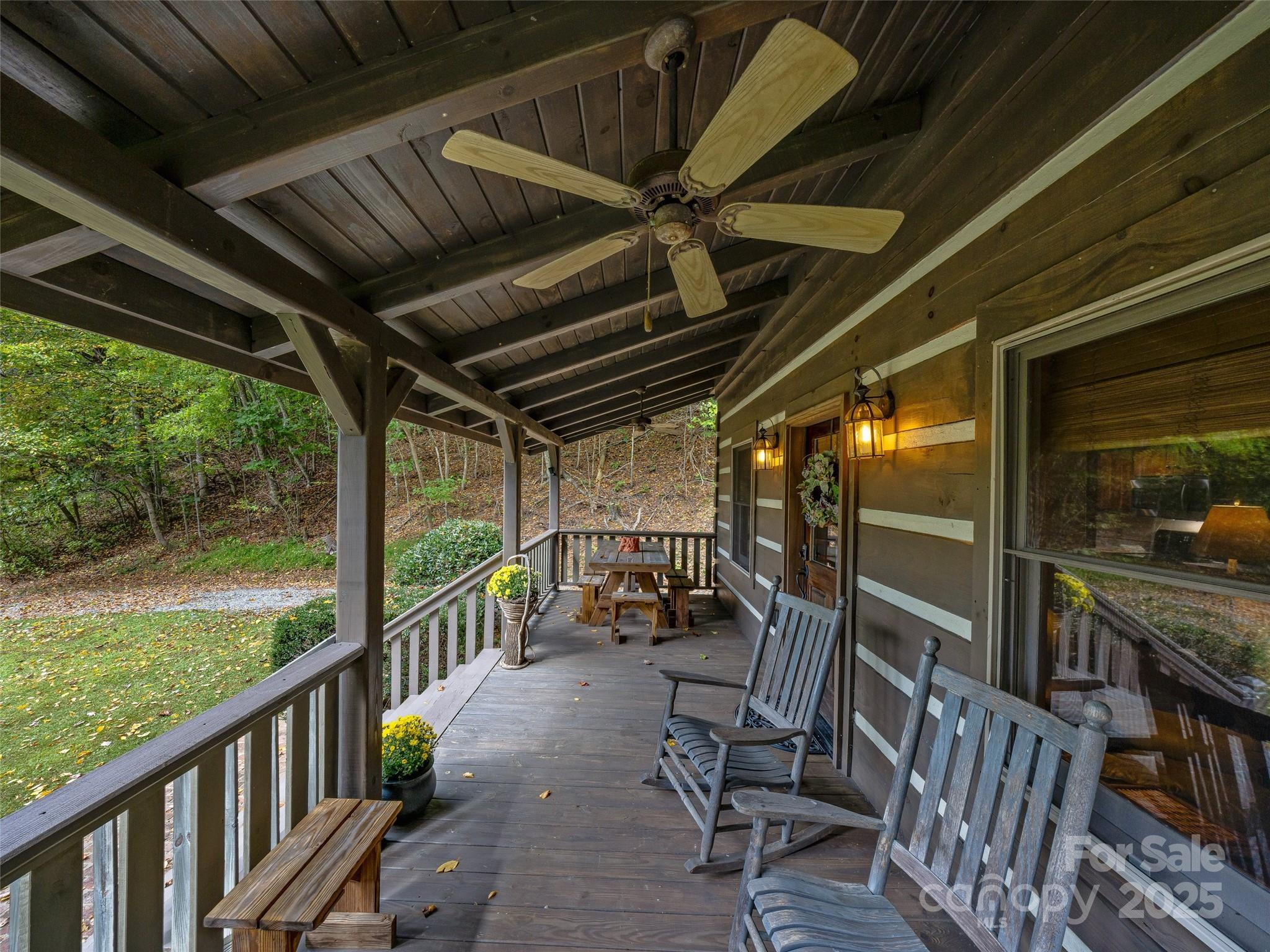 2725 Upper Brush Creek Road Marshall, NC 28753 - Photo 37 of 48 a view of a chairs and table in patio with wooden fence