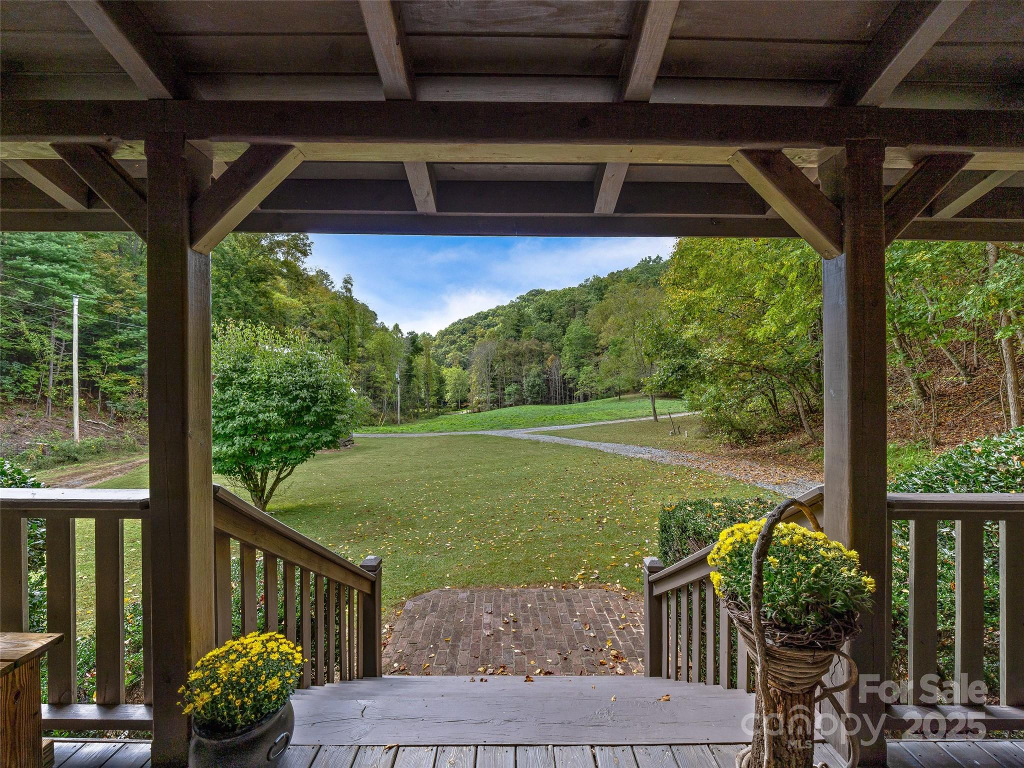 2725 Upper Brush Creek Road Marshall, NC 28753 - Photo 38 of 48 a view of a porch with furniture and a yard