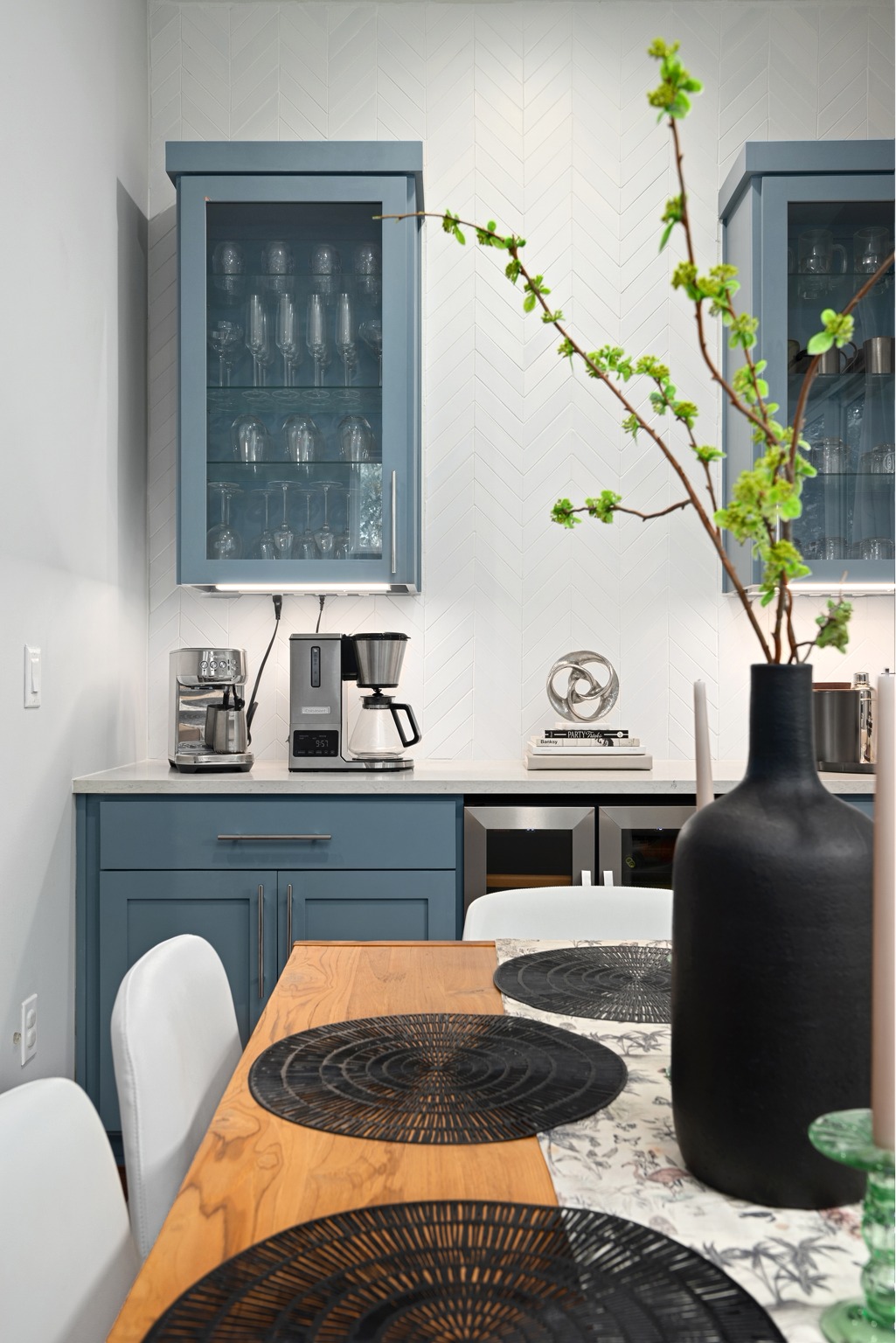 1103 Saucedo Street, Unit 1 Austin, TX 78721 - Photo 24 of 40 A chic dining area flows seamlessly into a well-appointed wet bar with stylish cabinetry.