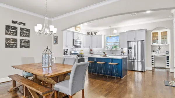 a view of a porch with furniture and a yard