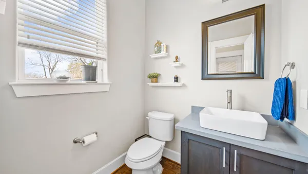 a bedroom with a bed and a desk