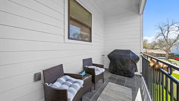 a bathroom with a toilet a sink and a window