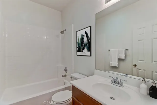 a bathroom with a sink toilet and bathtub