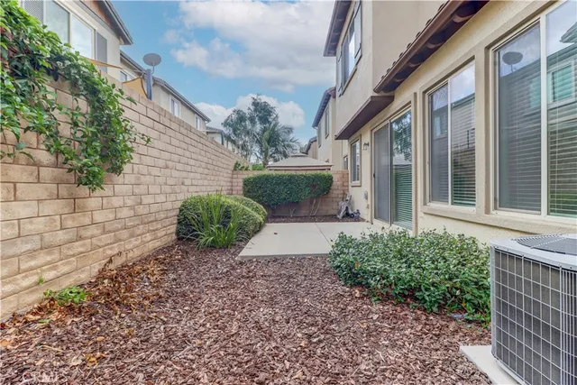 an outdoor sitting area with swimming pool