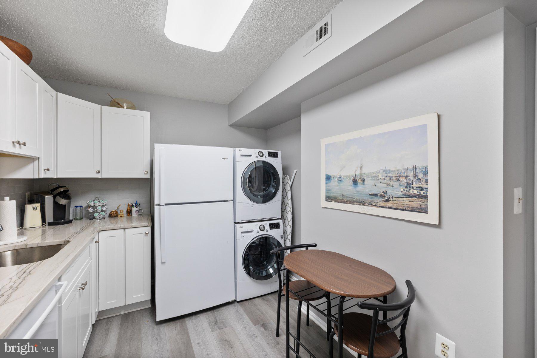 15107 Interlachen Drive, Unit 2822 Silver Spring, MD 20906 - Photo 12 of 35 a utility room with sink dryer and washer