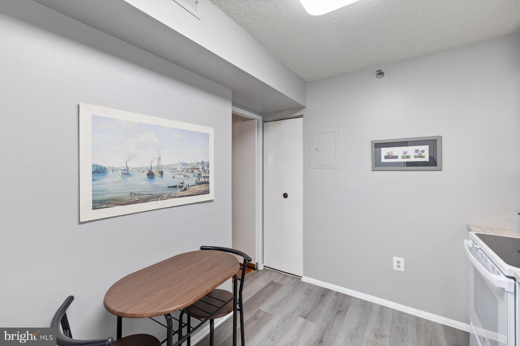 15107 Interlachen Drive, Unit 2822 Silver Spring, MD 20906 - Photo 13 of 35 a view of a livingroom with furniture and a workspace