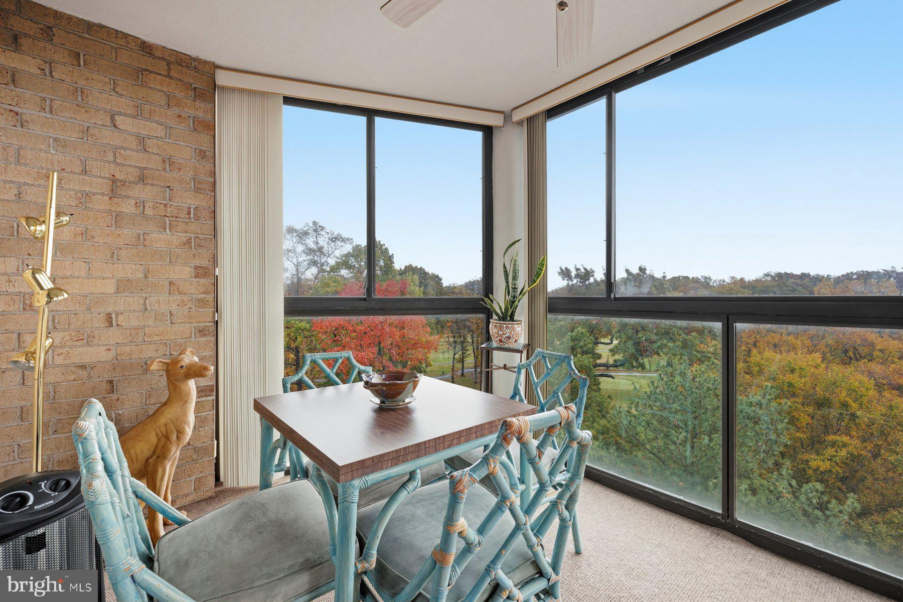 15107 Interlachen Drive, Unit 2822 Silver Spring, MD 20906 - Photo 20 of 35 a view of a city from a dining room with furniture