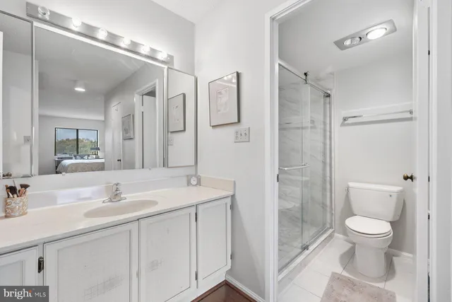 a living room with lots of furniture and a large window