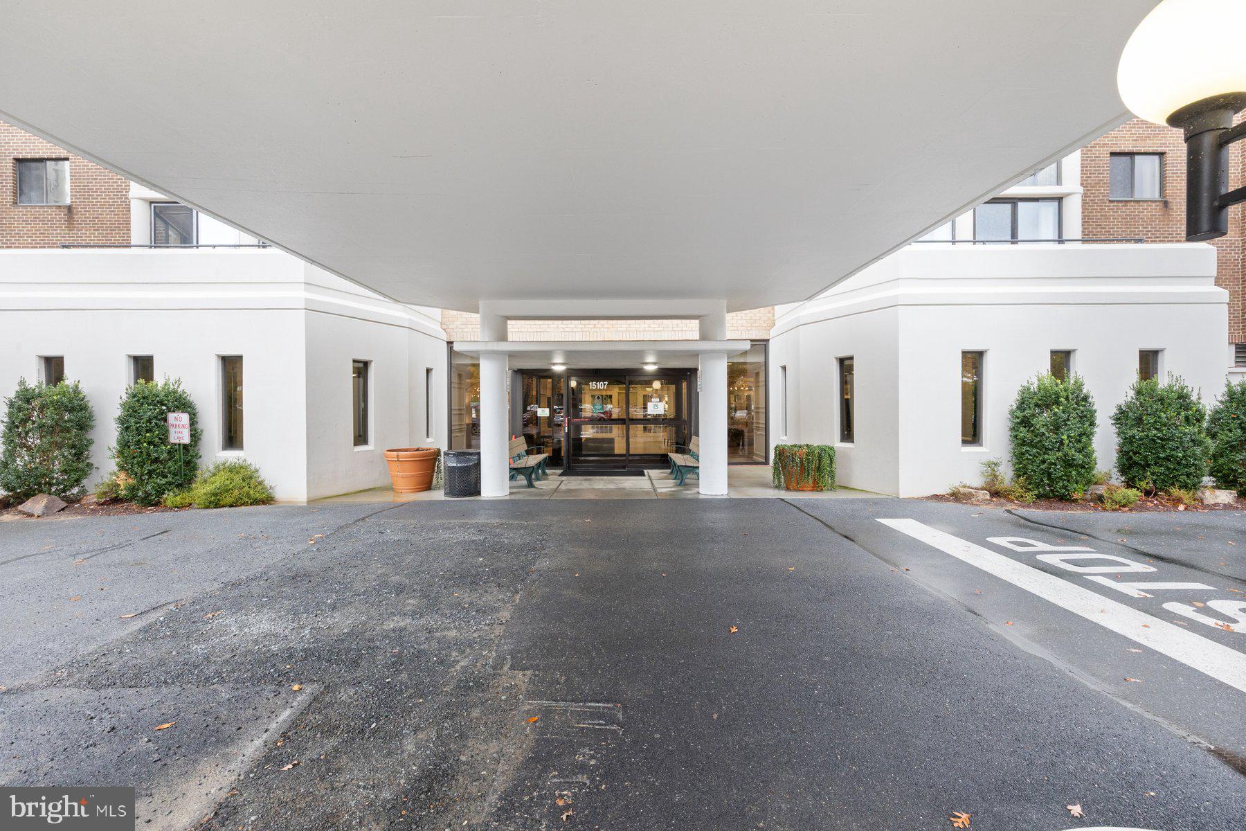 15107 Interlachen Drive, Unit 2822 Silver Spring, MD 20906 - Photo 3 of 35 a view of a white house with potted plants
