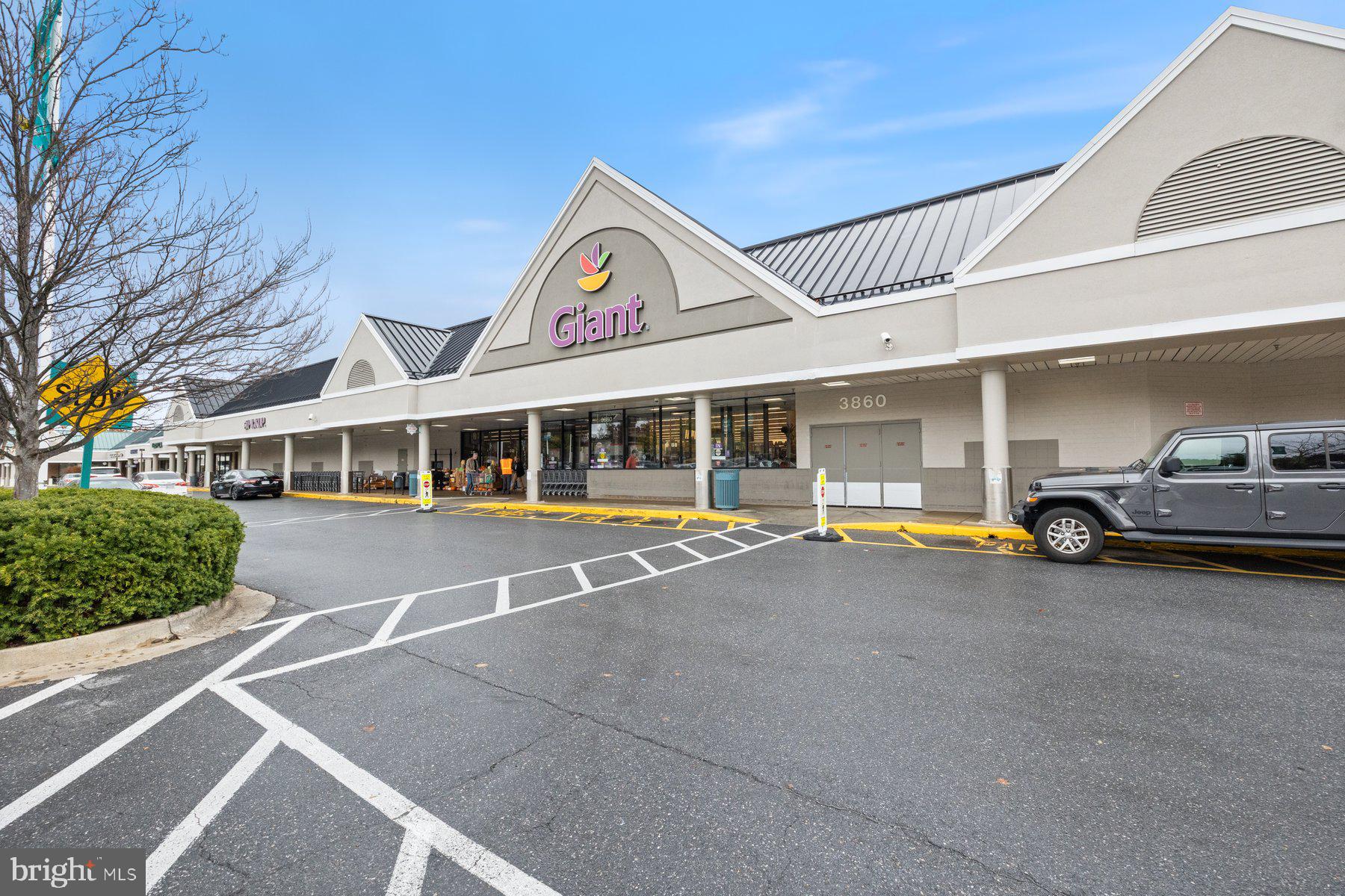 15107 Interlachen Drive, Unit 2822 Silver Spring, MD 20906 - Photo 33 of 35 a view of a house with cars park and front view of a house