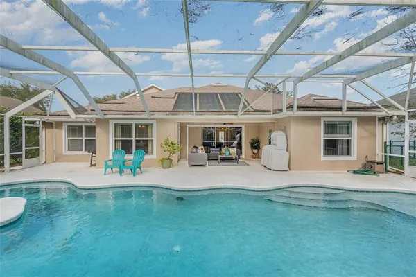 a house view with a sitting space and garden